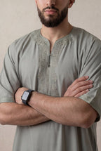 Moroccan Gandoura Sage Green Embroidery Detail – Arms Crossed Chest View